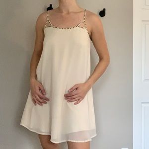 Flowy Cream Dress with Back Detailing